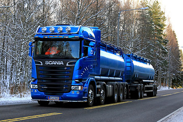 Image showing Blue Scania R580 Double Tanker Trucking on Winter Afternoon