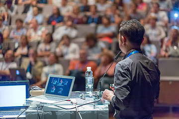 Image showing Public speaker giving talk at Business Event.