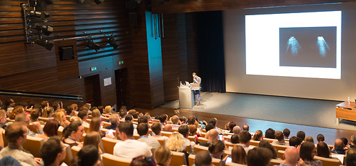 Image showing Business speaker giving a talk in conference hall.