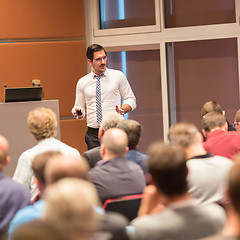 Image showing Business speaker giving a talk in conference hall.