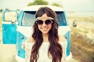 Image showing smiling young hippie woman in minivan car