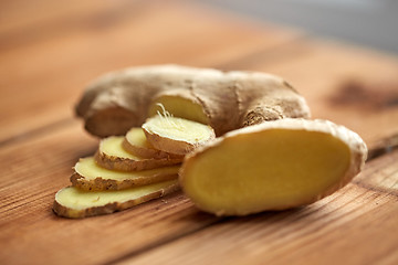 Image showing close up of ginger root on wooden table