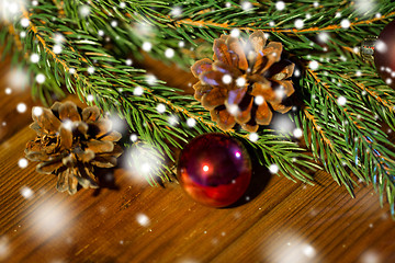 Image showing fir branch with christmas ball and pinecones