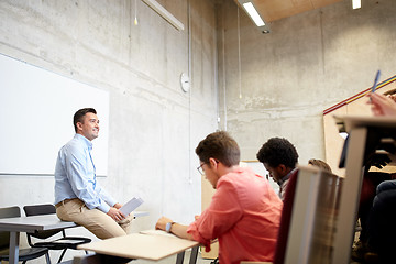 Image showing group of students and teacher at lecture