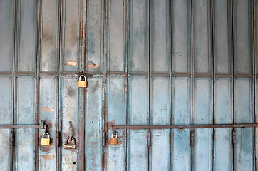 Image showing Metal lock on a blue door