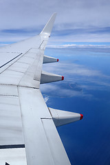 Image showing Wing of an airplane on blue sky