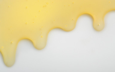 Image showing Honey liqiud flowing down