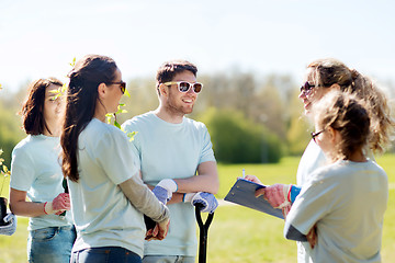 Image showing group of volunteers planting trees in park