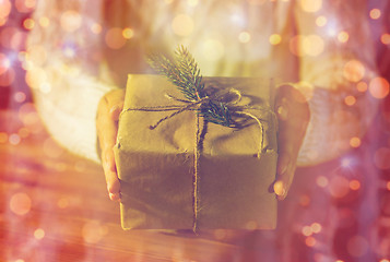 Image showing close up of woman with christmas gift