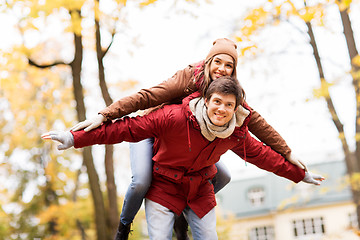 Image showing happy young couple having fun in autumn park