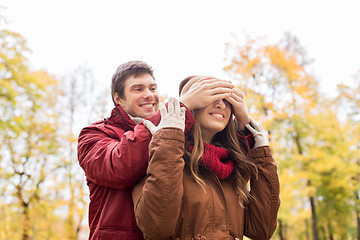 Image showing happy young couple having fun in autumn park