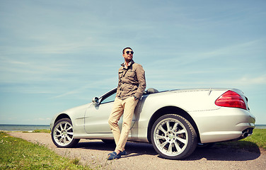 Image showing man near cabriolet car outdoors