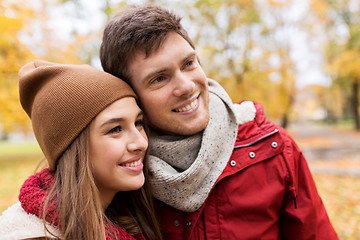 Image showing happy young couple walking in autumn park