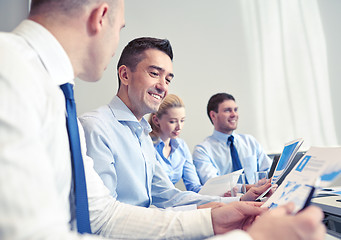 Image showing smiling business people meeting in office