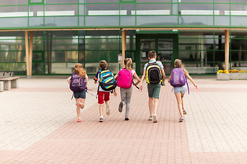 Image showing group of happy elementary school students running