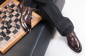 Image showing Man\'s Legs And Chess