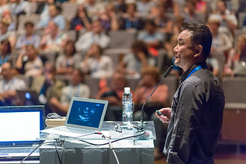 Image showing Public speaker giving talk at Business Event.