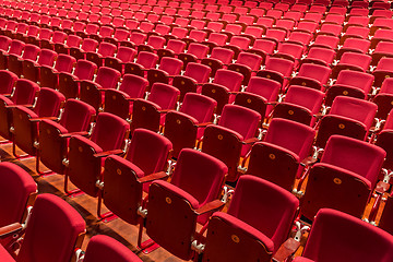 Image showing Red color theatre chair in conference room.