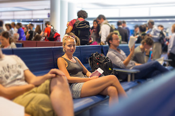 Image showing Female backpacker waiting at airpot departure gates.