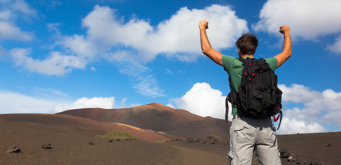 Image showing Man reaching the top of mountain.