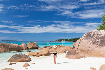 Image showing Woman enjoying Anse Lazio picture perfect beach on Praslin Island, Seychelles.