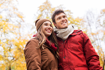 Image showing happy young couple walking in autumn park