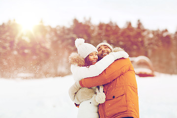 Image showing happy couple hugging and laughing in winter