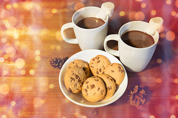 Image showing cups of hot chocolate with marshmallow and cookies