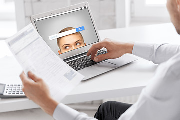 Image showing businessman with laptop computer working at office