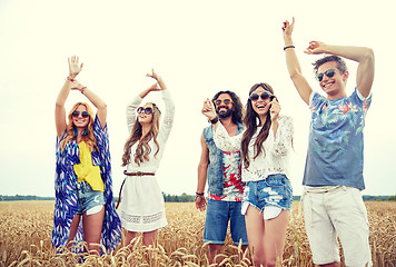 Image showing happy young hippie friends dancing outdoors