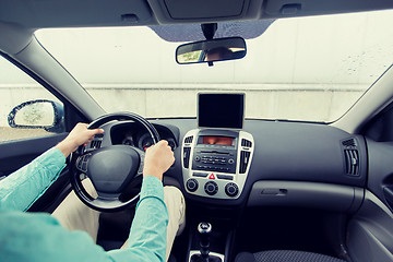 Image showing close up of young man with tablet pc driving car