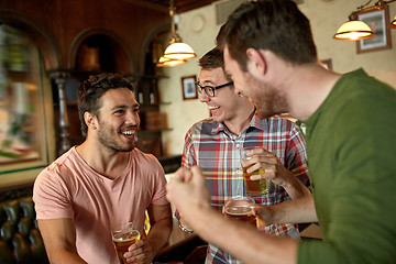 Image showing football fans or friends with beer at sport bar