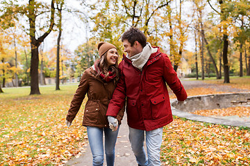 Image showing happy young couple walking in autumn park