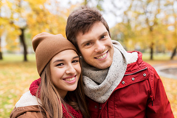 Image showing happy young couple walking in autumn park