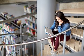 Image showing high school student girl reading book at library