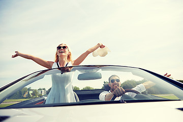 Image showing happy man and woman driving in cabriolet car