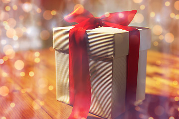 Image showing close up of christmas gift box on wooden table