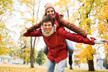 Image showing happy young couple having fun in autumn park