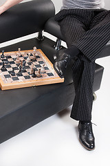 Image showing Man\'s Legs And Chess