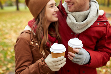 Image showing close up of happy couple with coffee in autumn