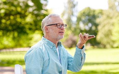 Image showing old man using voice command recorder on smartphone