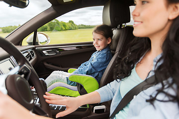 Image showing happy woman with little child driving in car