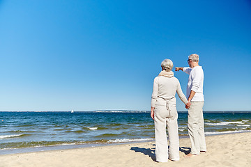 Image showing happy senior couple on summer beach