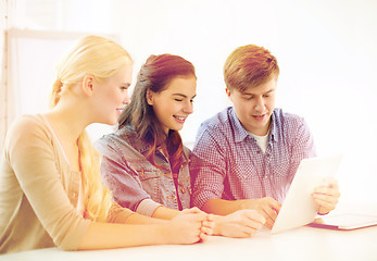 Image showing smiling students with tablet pc computer at school