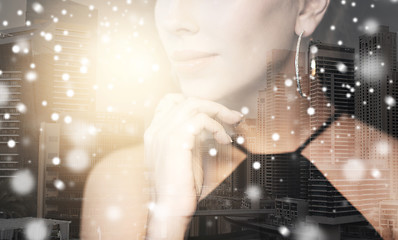 Image showing beautiful woman with jewelry over city and snow