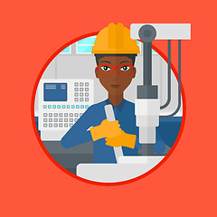 Image showing Woman working on industrial drilling machine.