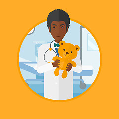 Image showing Pediatrician doctor holding teddy bear.