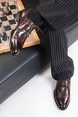 Image showing Man\'s Legs And Chess