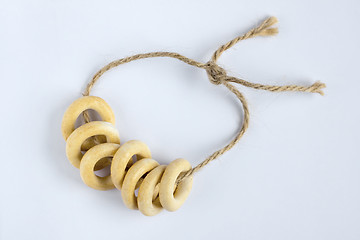 Image showing Small ring-shaped crackers on rope