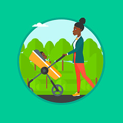 Image showing Mother walking with her baby in stroller.